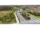 Community entrance with landscaping and signage at 11111 Callisia Dr, Odessa, FL 33556