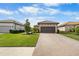 House exterior with landscaping and driveway at 11111 Callisia Dr, Odessa, FL 33556