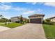 House exterior, paver driveway, landscaping at 11111 Callisia Dr, Odessa, FL 33556