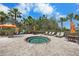 Community hot tub with surrounding seating and landscaping at 11111 Callisia Dr, Odessa, FL 33556