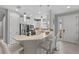 Modern kitchen with white cabinets, stainless steel appliances, and an island at 11111 Callisia Dr, Odessa, FL 33556