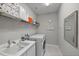 Laundry room with washer, dryer, and ample storage shelving at 11111 Callisia Dr, Odessa, FL 33556