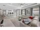 Open living room with sectional sofa and kitchen views at 11111 Callisia Dr, Odessa, FL 33556