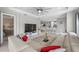 Open concept living room with sectional sofa and kitchen access at 11111 Callisia Dr, Odessa, FL 33556