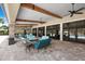 Community outdoor lounge with comfortable seating and ceiling fans at 11111 Callisia Dr, Odessa, FL 33556