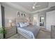 Main bedroom with large bed, ensuite bathroom, and walk-in closet at 11111 Callisia Dr, Odessa, FL 33556