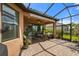Spacious covered patio with seating area, perfect for outdoor relaxation at 11111 Callisia Dr, Odessa, FL 33556
