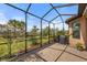 Spacious screened patio with paver floor and backyard access at 11111 Callisia Dr, Odessa, FL 33556