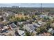 Aerial view showcasing the home and surrounding area, including a park and lake at 1318 E Louise Ave, Tampa, FL 33603