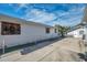 Large concrete backyard with a partial view of the house at 1318 E Louise Ave, Tampa, FL 33603