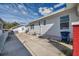 Side and back yard with concrete patio and storage bin at 1318 E Louise Ave, Tampa, FL 33603