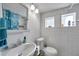 Clean bathroom with shower/tub combo and white tile at 1318 E Louise Ave, Tampa, FL 33603