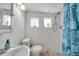 Clean bathroom with shower/tub combo and white tile at 1318 E Louise Ave, Tampa, FL 33603