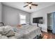 Main bedroom with a TV and ceiling fan at 1318 E Louise Ave, Tampa, FL 33603