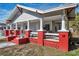 Charming house with a large front porch and red brick accents at 1318 E Louise Ave, Tampa, FL 33603