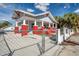 Home's exterior, side yard, and chain link fence at 1318 E Louise Ave, Tampa, FL 33603