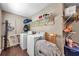 Laundry room with washer, dryer, and shelving at 1318 E Louise Ave, Tampa, FL 33603