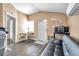 Bright living area with wood-look floors, and a view into another room at 1318 E Louise Ave, Tampa, FL 33603