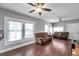 Bright living room featuring hardwood floors and ceiling fan at 1318 E Louise Ave, Tampa, FL 33603