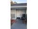 Charming home featuring a white front door with transom window, and a rocking chair on the porch at 16211 Rambling Vine W Dr, Tampa, FL 33624