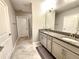 Double vanity bathroom with granite countertops at 17009 Clear Cork Dr, Wimauma, FL 33598