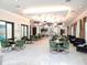 Elegant clubhouse interior with seating areas and a bar at 17009 Clear Cork Dr, Wimauma, FL 33598
