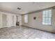 Simple bedroom with tiled floor and access to the bathroom at 1760 Kenesaw Ln, Clearwater, FL 33765