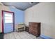 Bedroom with vintage dresser and exterior access at 1760 Kenesaw Ln, Clearwater, FL 33765