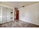 Bedroom with tiled floors and built-in closet at 1760 Kenesaw Ln, Clearwater, FL 33765