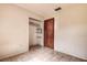 Bedroom with tiled floors and built-in closet at 1760 Kenesaw Ln, Clearwater, FL 33765