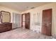 Bedroom with tiled floors and mirrored dresser at 1760 Kenesaw Ln, Clearwater, FL 33765