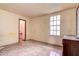 Small bedroom with tiled floors and a small bathroom at 1760 Kenesaw Ln, Clearwater, FL 33765