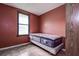 Small bedroom with a double bed and window at 1760 Kenesaw Ln, Clearwater, FL 33765