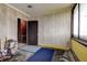 Spacious bonus room with wood paneling and storage at 1760 Kenesaw Ln, Clearwater, FL 33765