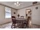 Cozy dining area with wood table and chairs, and access to the kitchen at 1760 Kenesaw Ln, Clearwater, FL 33765
