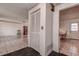 Interior hallway with tiled floors and access to other rooms at 1760 Kenesaw Ln, Clearwater, FL 33765