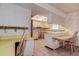 Dated kitchen features an island and built-in cabinetry at 1760 Kenesaw Ln, Clearwater, FL 33765