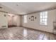 Bright living area with tiled floors and access to the foyer at 1760 Kenesaw Ln, Clearwater, FL 33765
