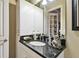 Small bathroom with granite countertop and single sink at 23 Concord Dr, Dunedin, FL 34698