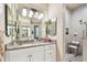 Bathroom with granite countertops and double sinks at 23 Concord Dr, Dunedin, FL 34698