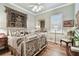 Bedroom with ornate bed frame and hardwood floors at 23 Concord Dr, Dunedin, FL 34698