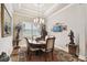 Formal dining room with a chandelier and hardwood floors at 23 Concord Dr, Dunedin, FL 34698