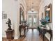 Elegant foyer featuring hardwood floors and art at 23 Concord Dr, Dunedin, FL 34698