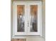 Elegant double front doors with etched glass details at 23 Concord Dr, Dunedin, FL 34698