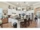 Island kitchen with granite countertops, white cabinets, and stainless steel appliances at 23 Concord Dr, Dunedin, FL 34698