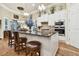 Modern kitchen with granite countertops, white cabinets, and stainless steel appliances at 23 Concord Dr, Dunedin, FL 34698