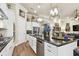 Large kitchen with an island, granite countertops, and stainless steel appliances at 23 Concord Dr, Dunedin, FL 34698