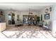 Relaxing covered patio with seating area and access to backyard at 23 Concord Dr, Dunedin, FL 34698