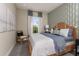 Bright bedroom with a comfortable bed and stylish decor at 29571 Velletri Ln, Wesley Chapel, FL 33545