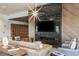 Modern community lounge with fireplace and comfortable seating at 29571 Velletri Ln, Wesley Chapel, FL 33545